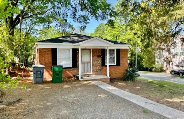 This cozy 2 bed 1 bath cottage style brick home is located on a corner lot of E 17th St and N McDowell St photos photos