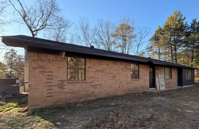 Welcome to this charming 4-bedroom, 2-bathroom home located in the scenic outskirts of Dover, AR. photos photos