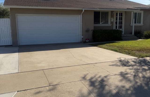 SPACIOUS & BREEZY HOME on a BEAUTIFUL TREE-LINED STREET! Gallery 1