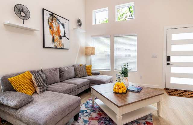 Spacious Fully Furnished 3BR/3BA home in a quiet neighborhood near downtown and beaches, featuring private baths, outdoor seating areas, fenced yard, and modern comforts—perfect for short or long-term stays. Gallery 3