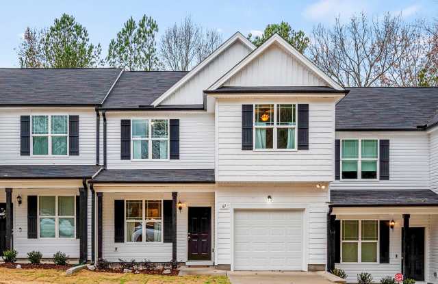MOVE IN READY! BRAND NEW 4 bedroom 2.5 bathroom townhome with GARAGE and WOODED VIEW! photos photos