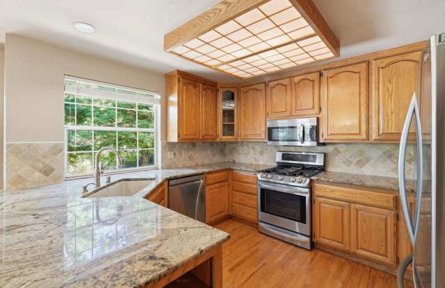 4-Bedroom Home with Wraparound Deck, 3-Car Garage & Private Setting! Gallery 4