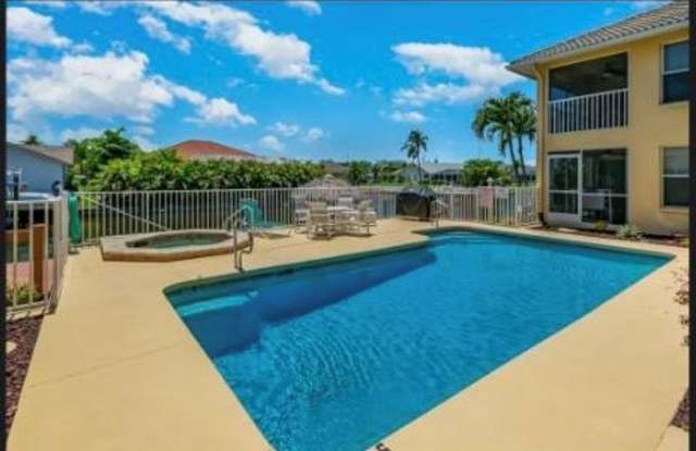 Gulf access canal View with Dock 3 Bedroom 2 Bath Furnished Condo Community Pool and Spa no pets photos photos