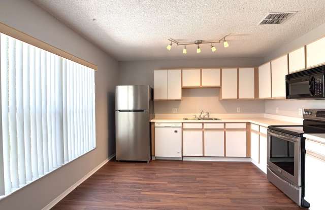 Move-In Ready! New Interior Paint! New Laminate Flooring! New Bathroom Tile! Lawn Care & Pest Control Included! Pet Friendly! Gated Community! Gallery 4