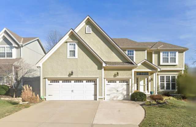 Beautiful and Spacious 4 Bed/4.5 Bath Overland Park Home with Finished Basement, 3-Car Garage, Hot Tub & Fenced Yard!! Gallery 1