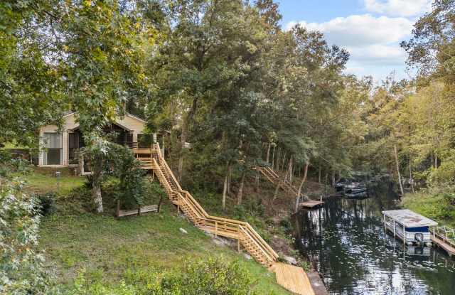 Beautifully updated 3-bedroom, 2-bathroom home situated on Lake Asbury, complete with a private dock, boat slip, and resident-only access to the Lake Asbury boat ramp photos photos