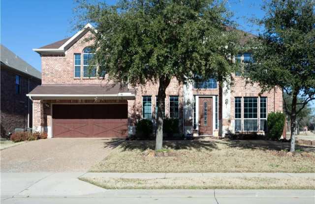 5 bedroom with game room, balcony, covered patio. 5th bedroom could be media room. Formals split at entry, kitchen has large island and open to the kitchen. - 10028 Promontory Drive, Frisco, TX 75035