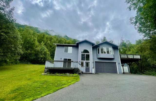 Fantastic 4 bedroom/3 bath/2 car garage home in prime secluded Chugiak location, additional carport, storage sheds and a big wrap around trex deck!! photos photos