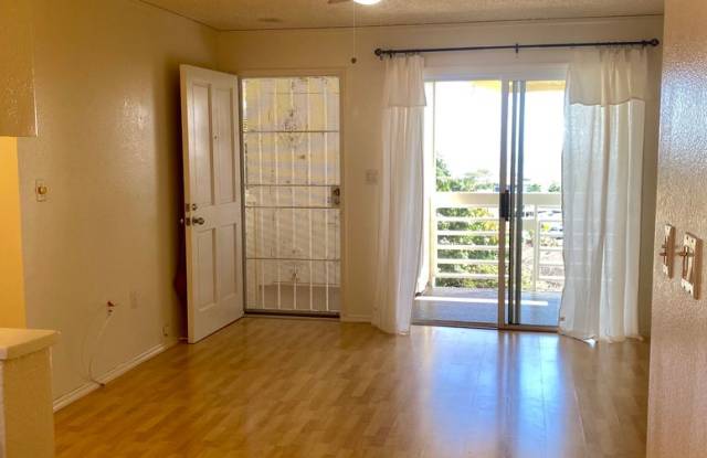 Available Now | 2 Bedroom, 1 Bathroom Apartment w/Scenic View from Enclosed Lanai | Kualana Knolls Community | Features: Window A/C in Bedrooms, In-Unit W/D & 2 Assigned Parking Spaces | Includes: Water, Sewer & Trash Gallery 1