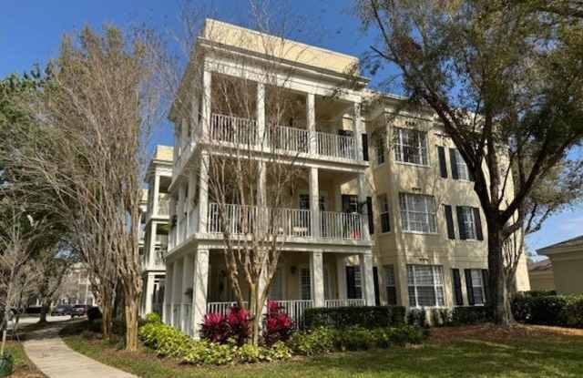 3 Bedroom 2 Bath corner unit with wrap around balcony in Elevator Building in East Village of Celebration photos photos