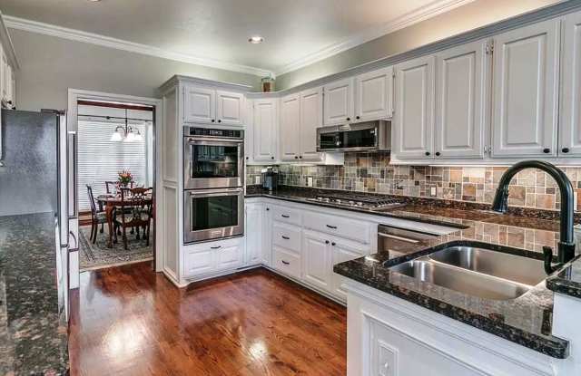 Executive Living in Norman complete with New carpet and Safe room! Private pool with heater option ! 1 bed guest house! 2 huge living areas, 2 dining areas, smart features and 2 cozy fireplaces! photos photos