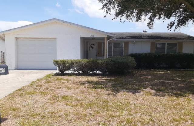 2/1.5/1 1000 Sq. Ft. Spacious living room, Lanai, fenced in yard, and tile floors thoughout! photos photos