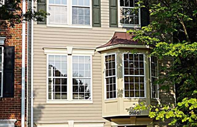 A gorgeous townhouse with one-car garage in a desired community in Germantown! photos photos