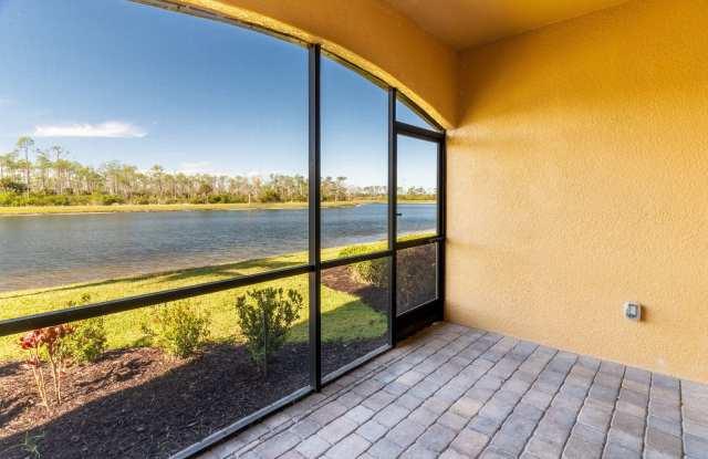 Stunning 2BR/2BA Acqua Ct. First-Floor Unit with Lake Views in Treviso Bay – Resort-Style Living Awaits! photos photos