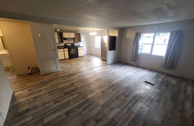Freshly painted spacious 2-bedroom 1-bath home with a screened porch and storage shed. photos photos
