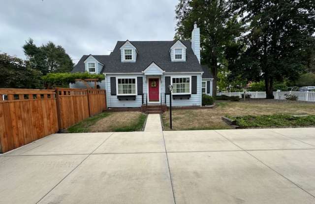 Furnished Story Book Home near Campus with a large maintained yard photos photos
