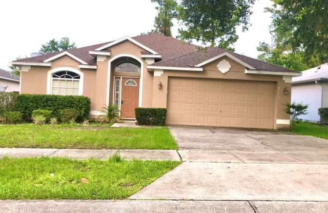 WELCOME HOME! MOVE IN NOW! Spacious 3 Bedroom 2 Bathroom home with nice backyard as well as conservation area in the back! - 4119 Coralbrooke Grove, University, FL 32826
