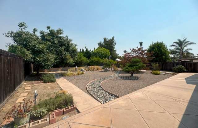 Welcoming Single-Level Home in a Great Neighborhood! With gorgeous landscaping and plentiful fruit trees. Gallery 1
