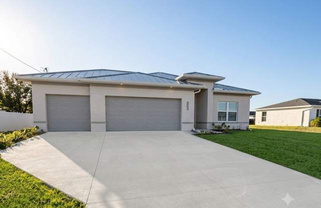 Brand-New Corner Lot Home with 3-Car Garage & Fenced Yard | Luxury Living in Cape Coral! photos photos Brand-New Corner Lot Home with 3-Car Garage & Fenced Yard | Luxury Living in Cape Coral! photos photos