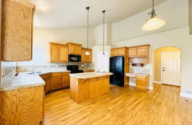 Stunning Executive 4 Bedroom 2 Bath Home in Northwest Loveland - 3-Car Garage and neighborhood pool access! photos photos