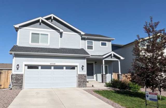 4 Bedrooms | 3.5 Bathrooms | 2-Car Garage | Finished Walkout Basement | Fenced Yard | Pikes Peak Views Gallery 3