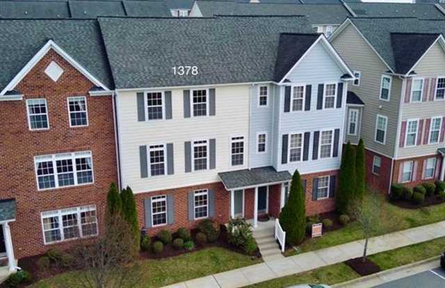 Walk to Bonefish & Target from this like new multi-level 4 bedroom, 3.5 bath townhome! photos photos