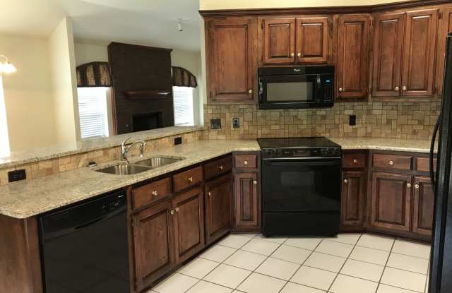 Beautiful granite and tile backsplash to update the large kitchen. 3 bedrooms + an office, large master, corner lot! photos photos