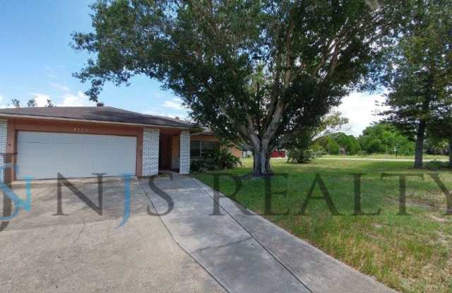 JUST REDUCED!!! 3/2/2 1500 Sq. Ft. with fenced yard, tile floors, HUGE living room and a corner lot!! photos photos