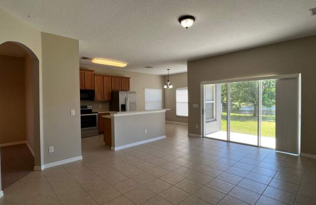 Beautiful 4 Bedroom 3 Bathroom Lake View Home in Gated Community of Timber Isle - 16950 Deer Oak Lane, Alafaya, FL 32828