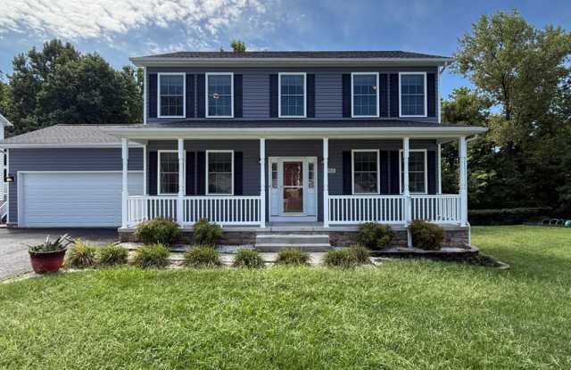 Luxury 5 Bedroom Home with Finished Basement Suite, Covered Deck & EV Charger in Parkville photos photos
