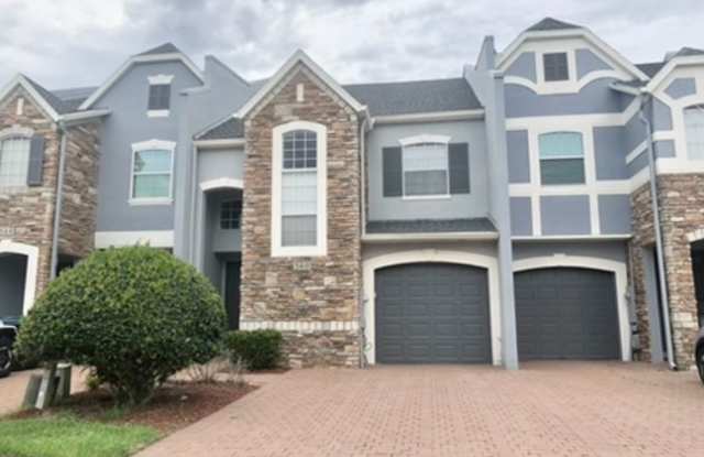 Move in NOW!WATER VIEW!! Stunning 4 bedroom + Loft, 2.5 bath Townhome Gated community in Avalon Park. 1 car attached garage. HOA handles lawn care. Primary bedroom on 1st floor. Gallery 1
