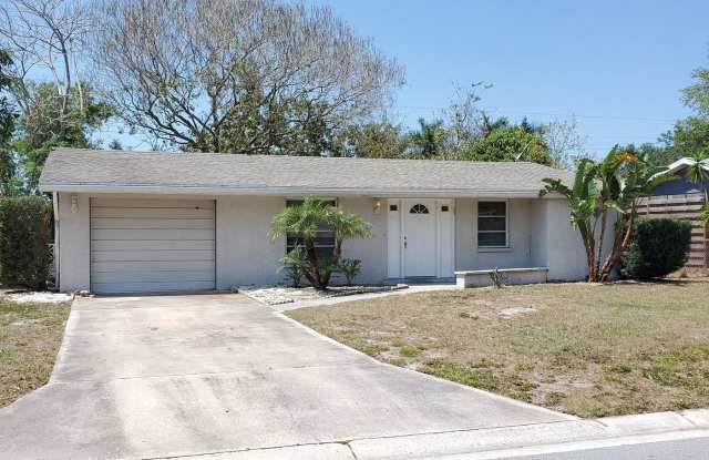 CHARMING 2 BEDROOM 2 BATHROOM + LARGE SUNROOM SINGLE FAMILY HOME WITH A ONE CAR GARAGE LOCATED IN THE HEART OF SARASOTA! Gallery 1