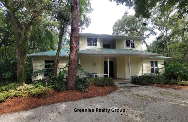 Private, gated Tarpon Springs oasis with 4 beds, 4.5 baths, a theater, chef’s kitchen, and resort-style pool—luxury living just minutes from beaches and the Sponge Docks! photos photos