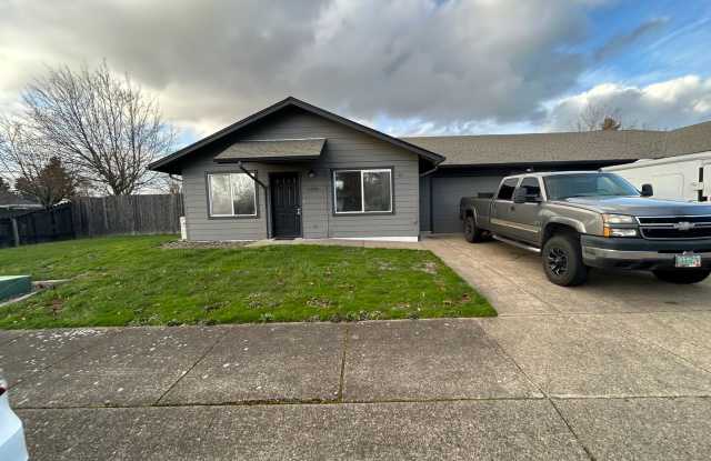 Beautifully Remodeled 2 Bedroom 1 Bath Duplex w/ Large Yard!! Pets are welcome! Electric car charging station in garage! photos photos