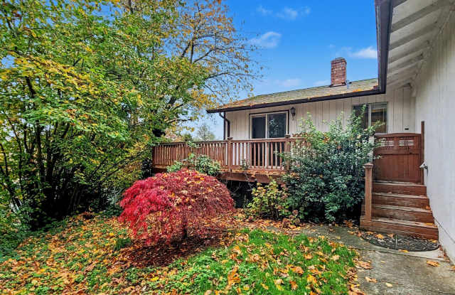AVAILABLE NOW! Charming West Seattle Home featuring a garage, spacious deck, and wood-burning fireplace photos photos