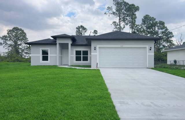 NEW CONSTRUCTION-Spacious 4 Bed / 2 Bath / 2 Car Garage Home in Lehigh Acres photos photos