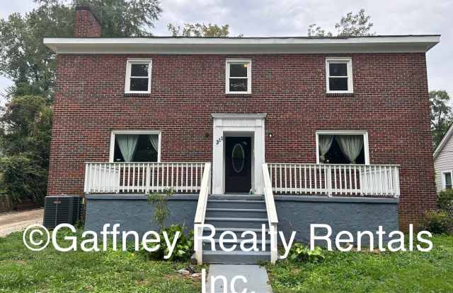 Spacious 4-Bedroom Brick Home with Hardwood Floors and Walk-In Closet photos photos