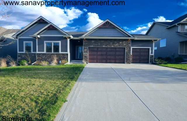 "Luxury Ranch Living: Your Dream Home with Furnished Basement in Urbandale" photos photos