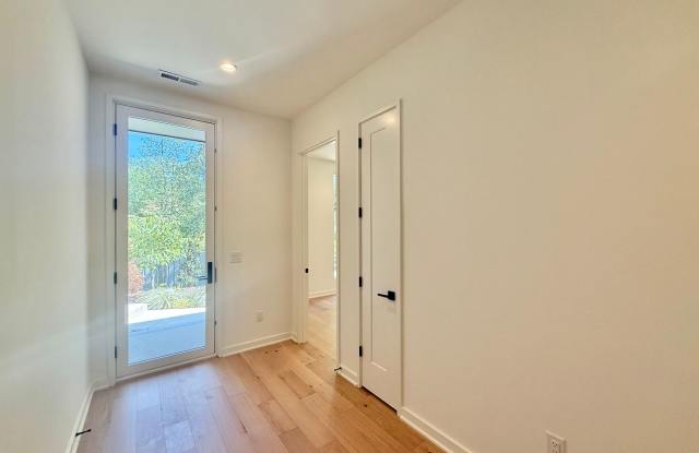 Luxurious New Construction 4BD, 2.5BA Raleigh Townhome with a 1-Car Garage & Rooftop Terrace in a Prime Location Near Tons of Shopping & Dining Options Gallery 3