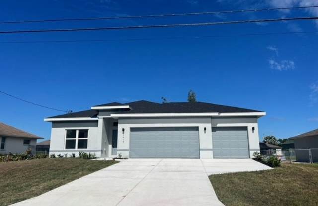 Brand-New Canal Front Home with Private Dock, 3-Car Garage & Modern Upgrades in Cape Coral Gallery 1