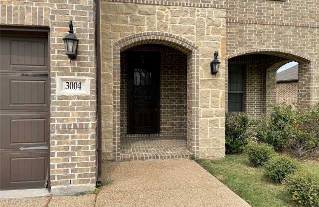 A stunning 4-bedroom, 2.5-bath home with dual living areas, a chef’s kitchen, elegant master suite, covered outdoor spaces, and prime location within walking distance to schools. photos photos