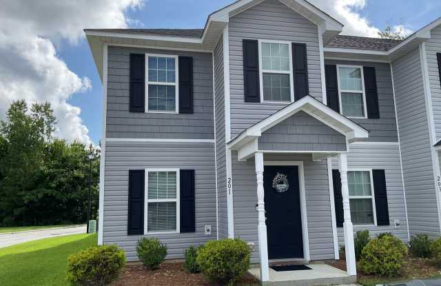 Featuring 2 bedrooms and 2.5 bathrooms. The main level features a welcoming living area, a kitchen with ample cabinet space, and a convenient half bathroom. Gallery 1