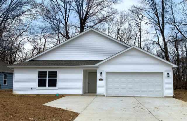 Experience modern living in this beautifully designed 4-bedroom, 2 full-bath home in East Terre Haute. photos photos