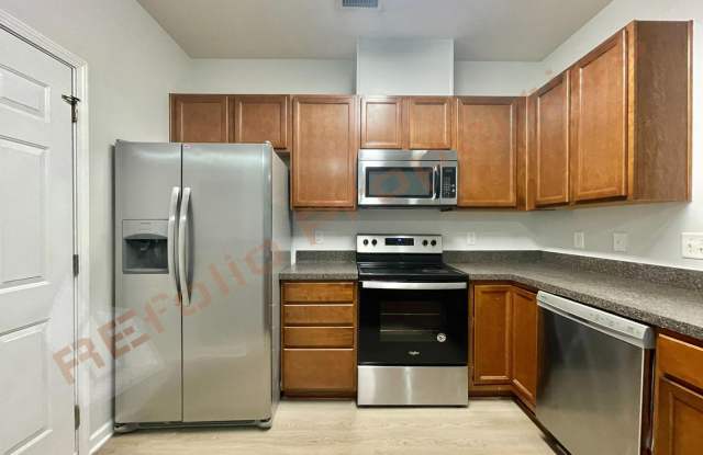 Welcome to this 3-bedroom, 2.5-bathroom, 1-car garage end-unit townhome in Davis Village, Cary, Available Now! Gallery 4