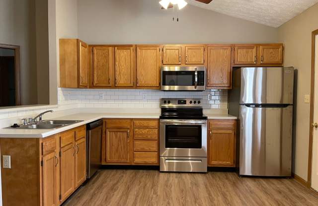 Wake up to a stunning pond view in this beautiful 2 BD 2BA duplex with a 2 car attached garage photos photos