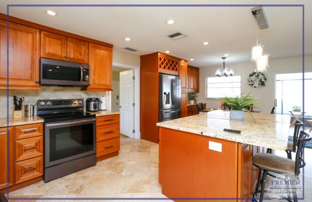 *** LOCATION LOCATION LOCATION ** THIS NICELY DECORATED 4/3 HOME CLOSE TO MERCATO *** PERFECT FOR THE SEASONAL VISITOR** - 698 107th Avenue North, Naples Park, FL 34108