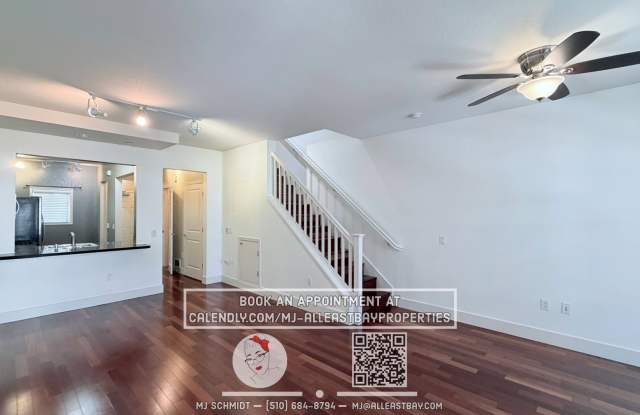 2-bed, 1.5-bath two-story condo, with rich hardwood floors, a modern kitchen, and spacious bedrooms with natural light. located above bustling Bay St. with shopping and restaurants steps away. Gallery 1