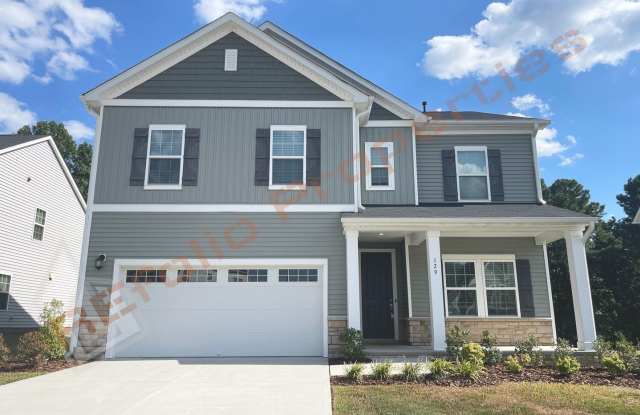 Great news! Application fee will be credited toward your first month’s rent upon lease is executed. Beautiful 5 Bedroom 2-Car Garage Home with First Floor Guest Suite  Screened-in Porch in Clifford Glen, Garner, Available Now! - 129 Axis Deer Lane, Wake County, NC 27529