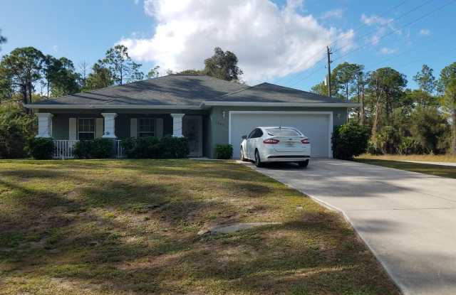RECENTLY REDUCED! Charming 3 Bedroom 2 Bathroom Home with A Bonus Room in Lehigh Acres - 1623 Oak Avenue, Lehigh Acres, FL 33972 RECENTLY REDUCED! Charming 3 Bedroom 2 Bathroom Home with A Bonus Room in Lehigh Acres - 1623 Oak Avenue, Lehigh Acres, FL 33972