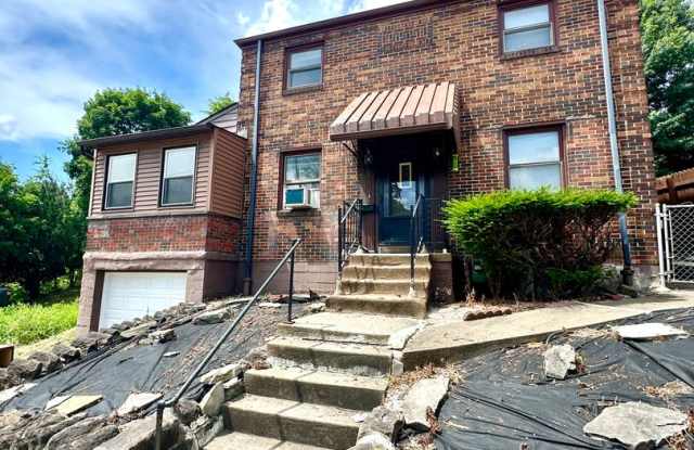 Updated 2 Bed, 1 Bath Home in Braddock Hills - Off-Street Parking, Large Backyard - Available Now! - 1424 Brinton Avenue, North Braddock, PA 15104